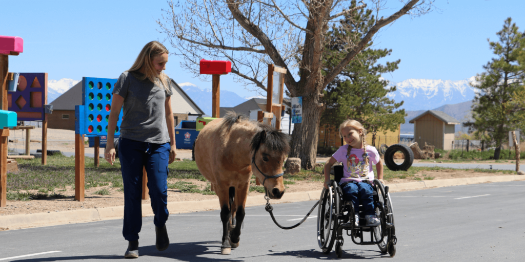 Horse and Child With Wheelchair at Therapy Center | Strides Pediatric Therapy